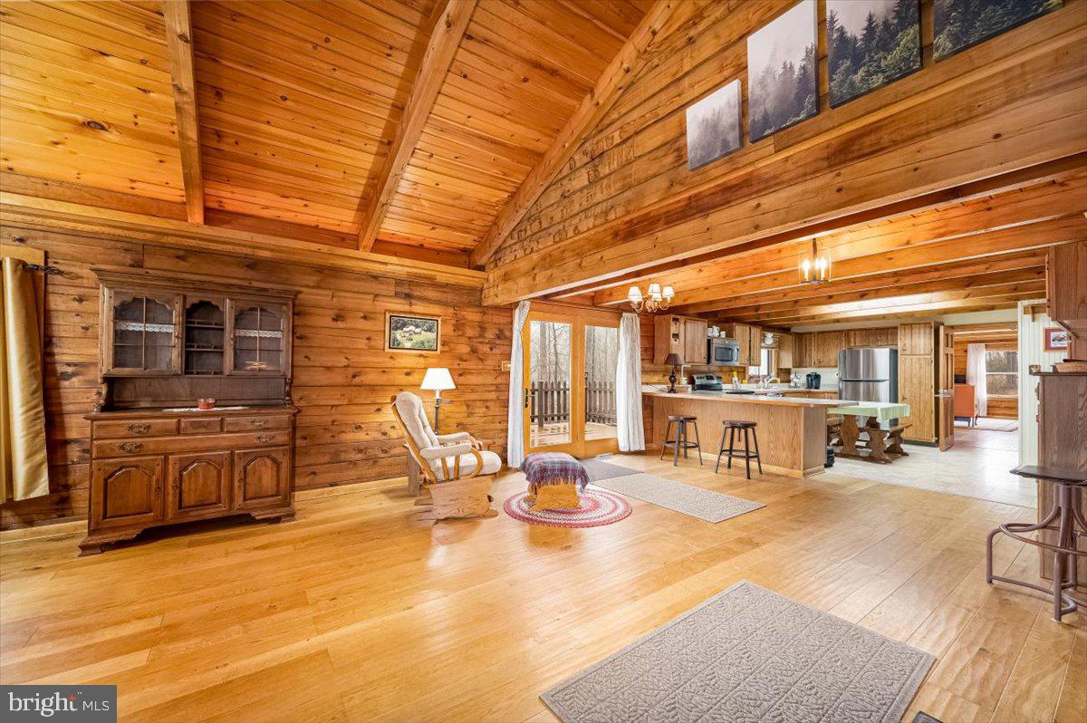 2324 Carrollton Road Westminster, MD 21157 - Photo 9 of 66 a view of a patio with dining table and chairs with wooden floor