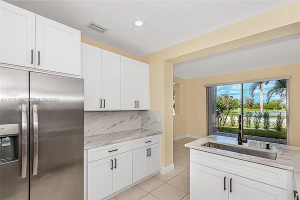a kitchen with a sink and cabinets