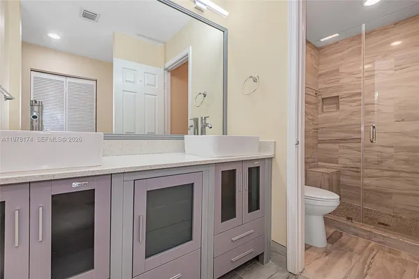 a bathroom with a sink and a toilet