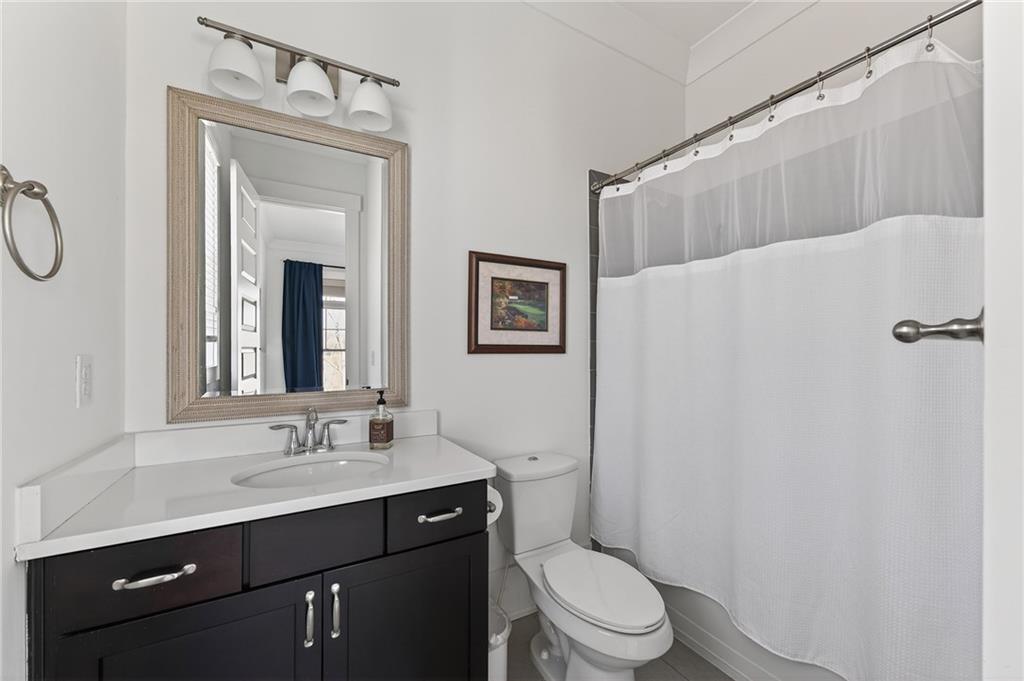 554 Gables Run Milton, GA 30004 - Photo 12 of 47 a bathroom with a sink a toilet and shower