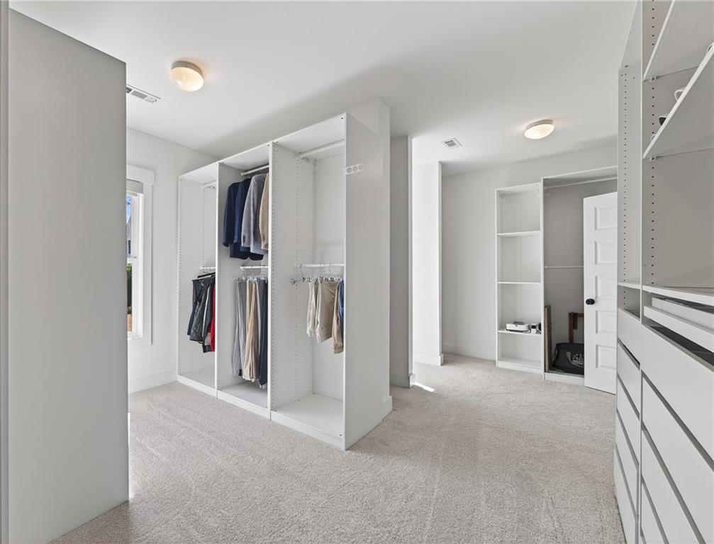554 Gables Run Milton, GA 30004 - Photo 20 of 47 a view of a hallway with closet and a bathroom