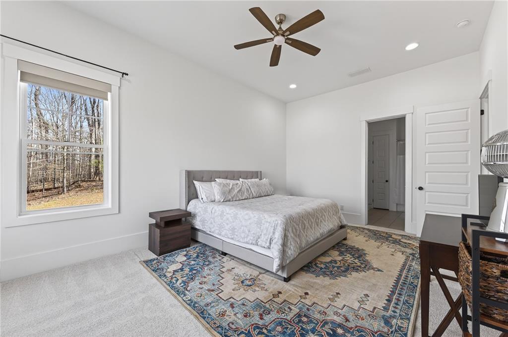 554 Gables Run Milton, GA 30004 - Photo 31 of 47 a bedroom with a bed and a window