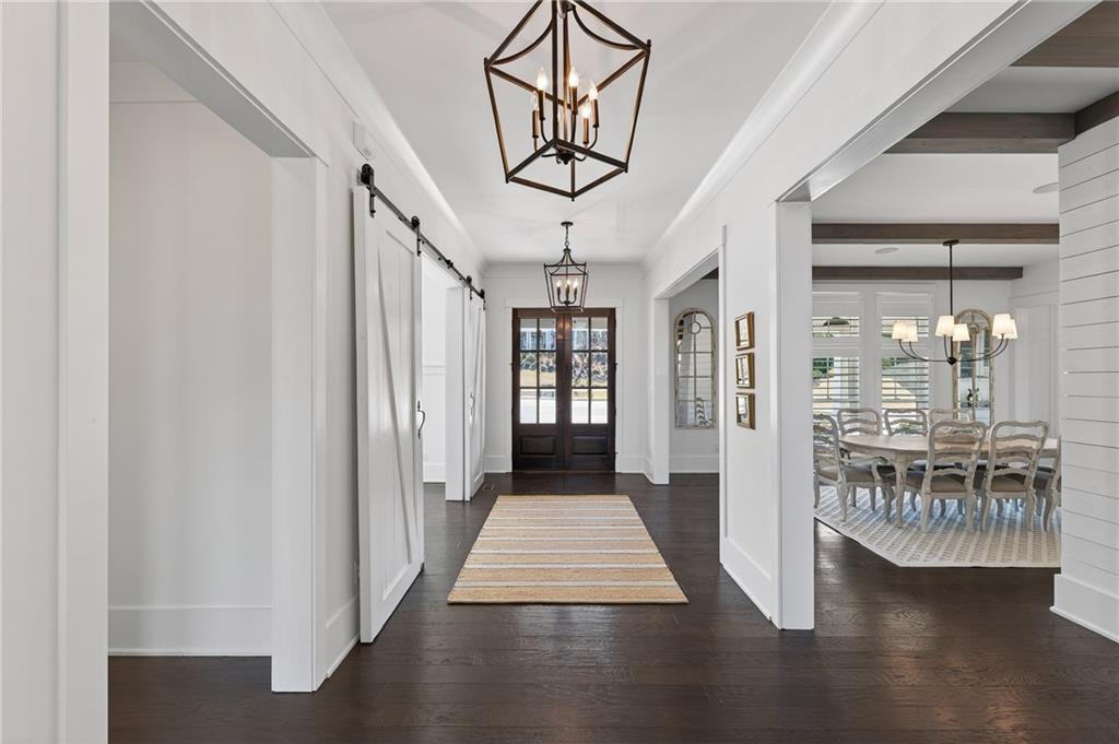 554 Gables Run Milton, GA 30004 - Photo 4 of 47 a view of a hallway with wooden floor and entryway