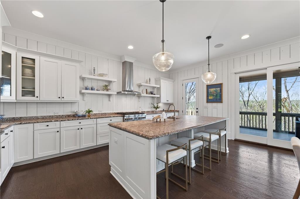 554 Gables Run Milton, GA 30004 - Photo 9 of 47 a large kitchen with kitchen island a large island in the center
