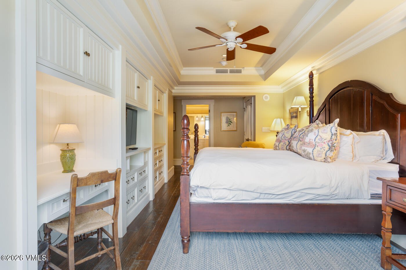 1 Willow Bridge Road, Unit 33 Vail, CO 81657 - Photo 13 of 40 a spacious bedroom with a bed and a chandelier