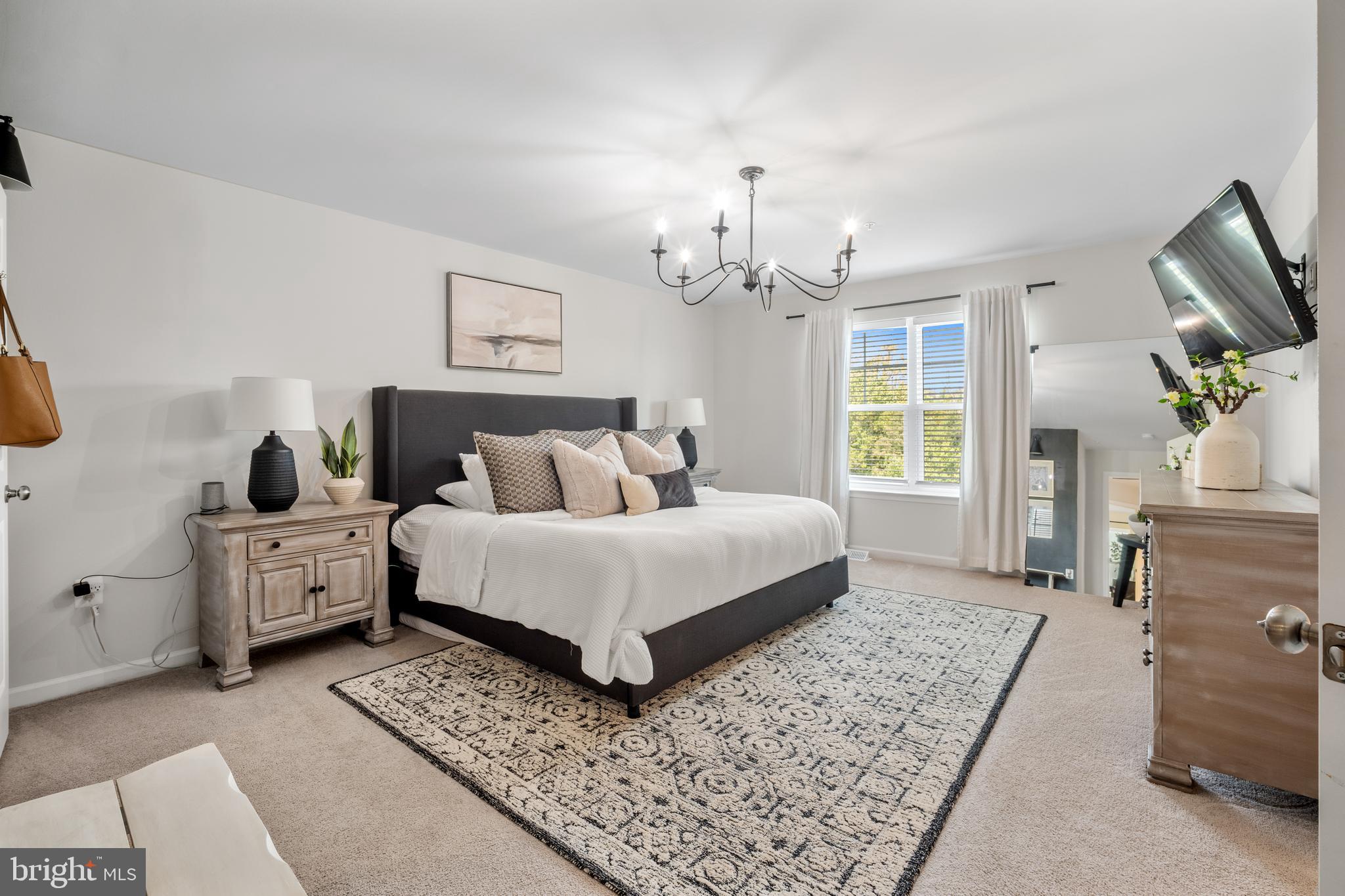 15946 Coolidge Avenue Silver Spring, MD 20906 - Photo 14 of 49 a spacious bedroom with a large bed and a window