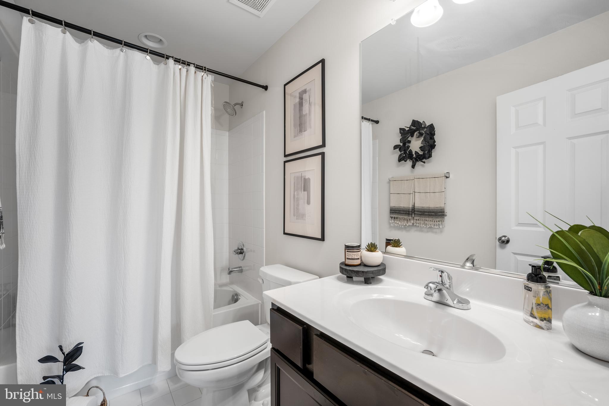 15946 Coolidge Avenue Silver Spring, MD 20906 - Photo 20 of 49 a bathroom with a sink toilet and shower