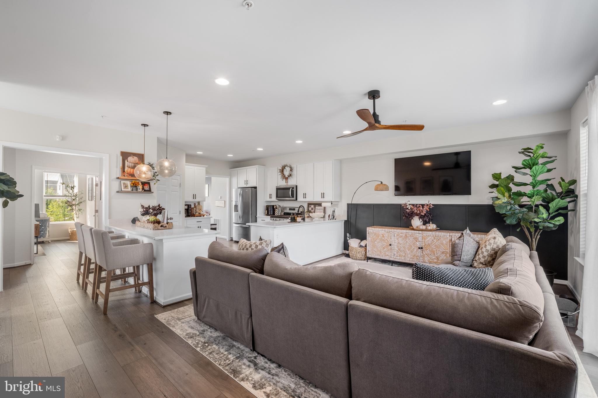 15946 Coolidge Avenue Silver Spring, MD 20906 - Photo 26 of 49 a living room with furniture and a flat screen tv