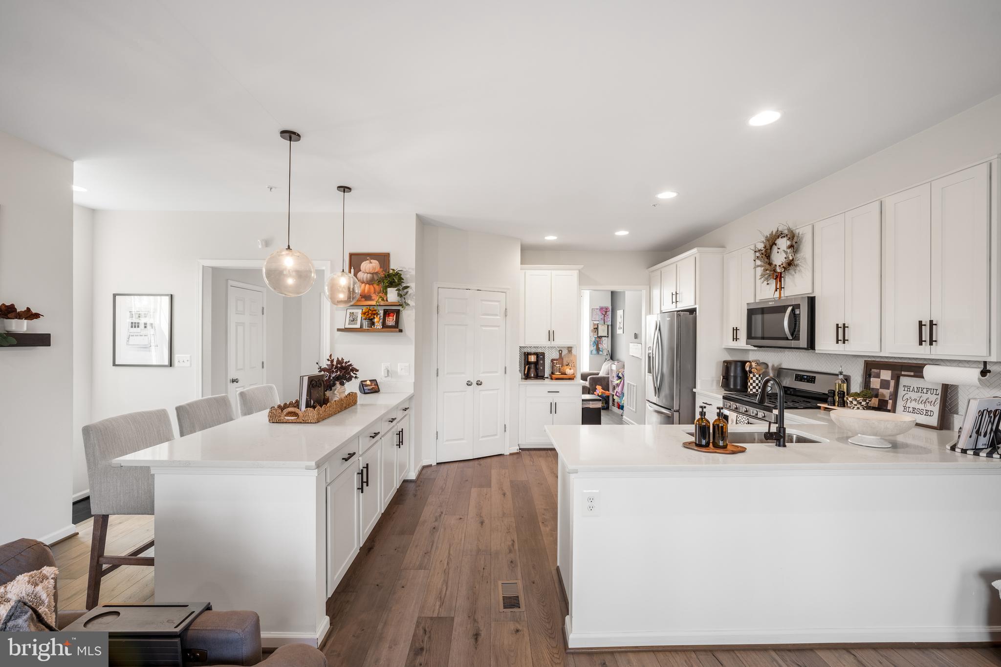 15946 Coolidge Avenue Silver Spring, MD 20906 - Photo 30 of 49 a very nice looking living room with kitchen island furniture and a wooden floor