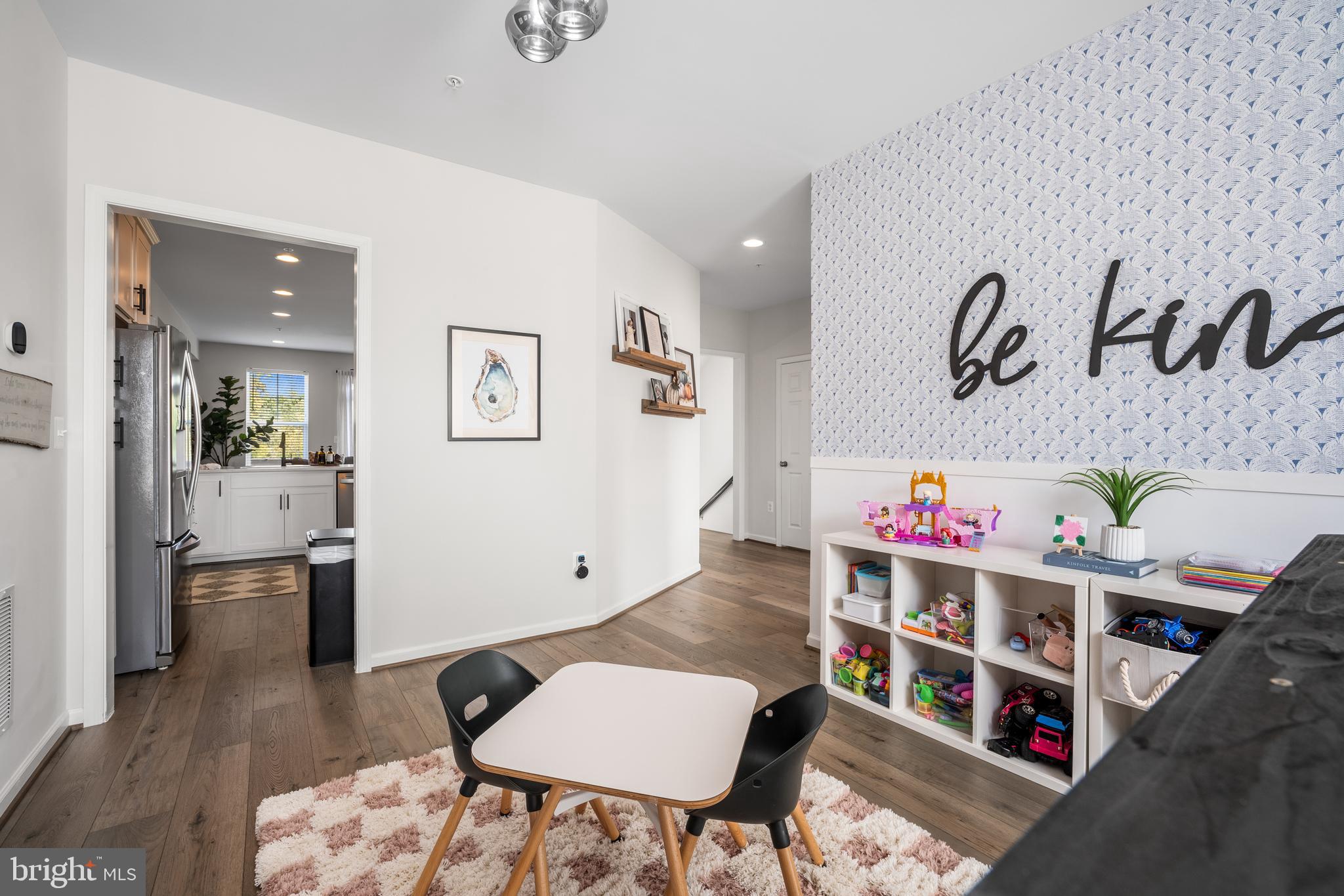 15946 Coolidge Avenue Silver Spring, MD 20906 - Photo 34 of 49 a living room with a wooden floor and a table