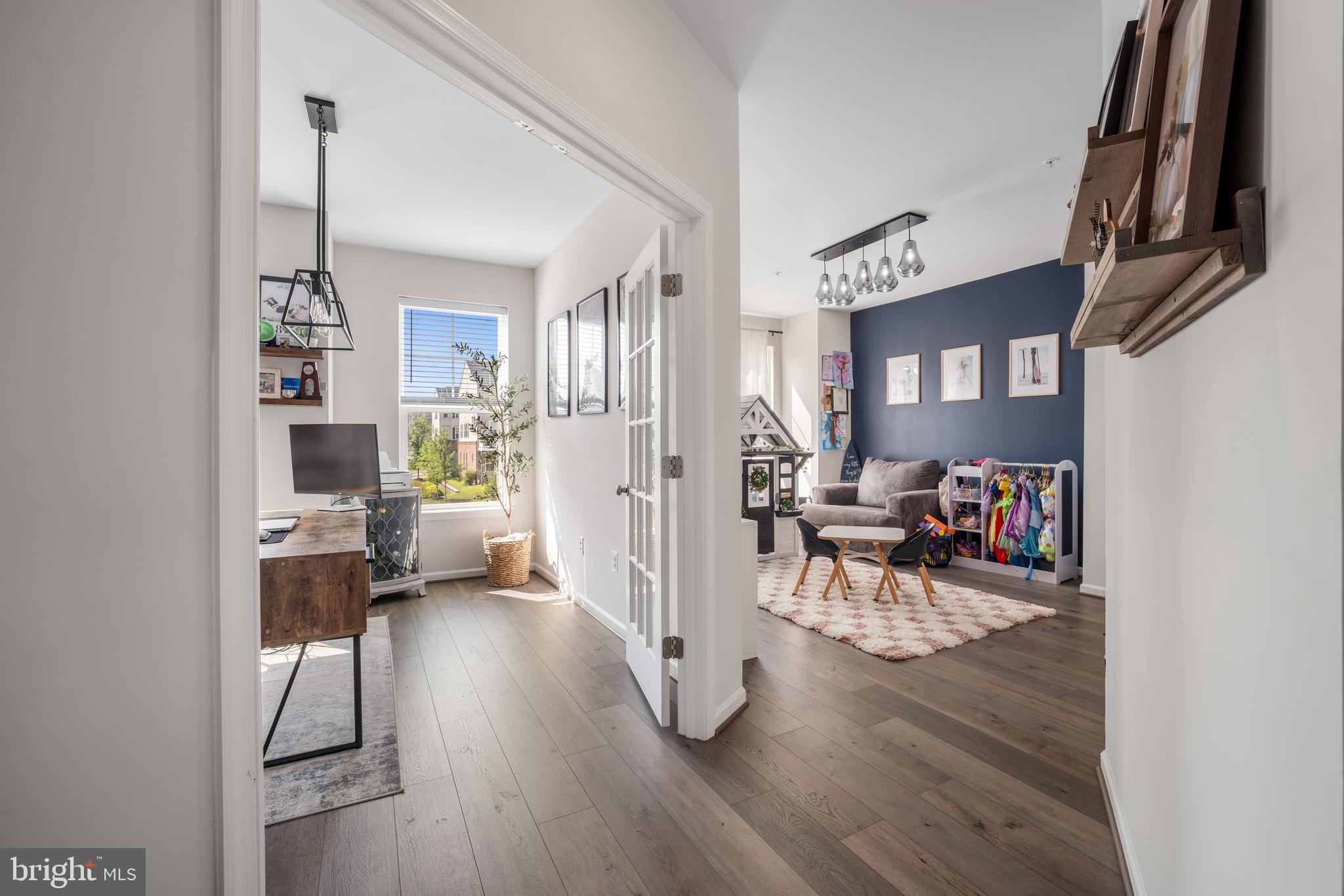 15946 Coolidge Avenue Silver Spring, MD 20906 - Photo 36 of 49 a living room with furniture and a wooden floor
