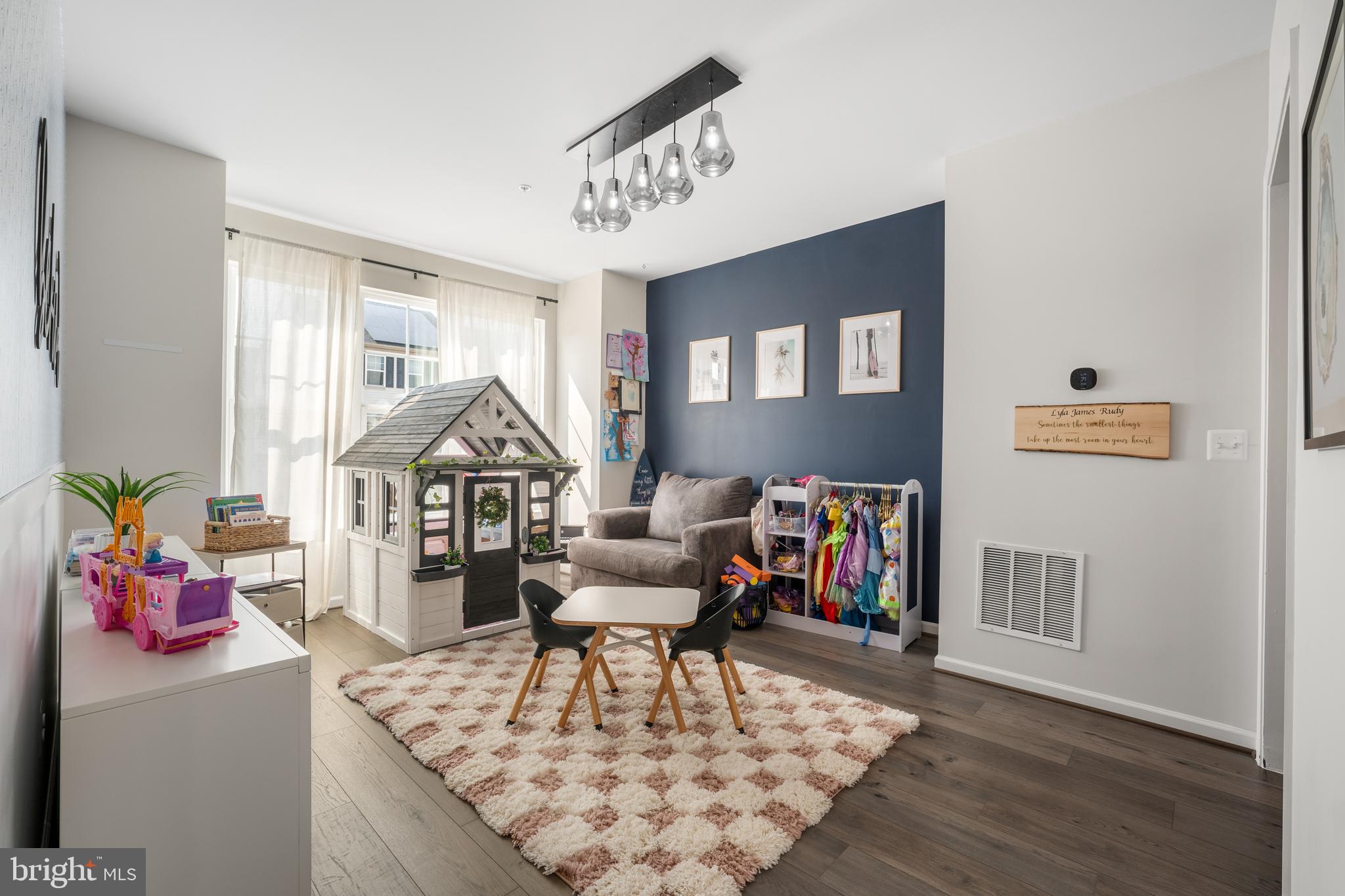 15946 Coolidge Avenue Silver Spring, MD 20906 - Photo 39 of 49 a living room with furniture and a flat screen tv