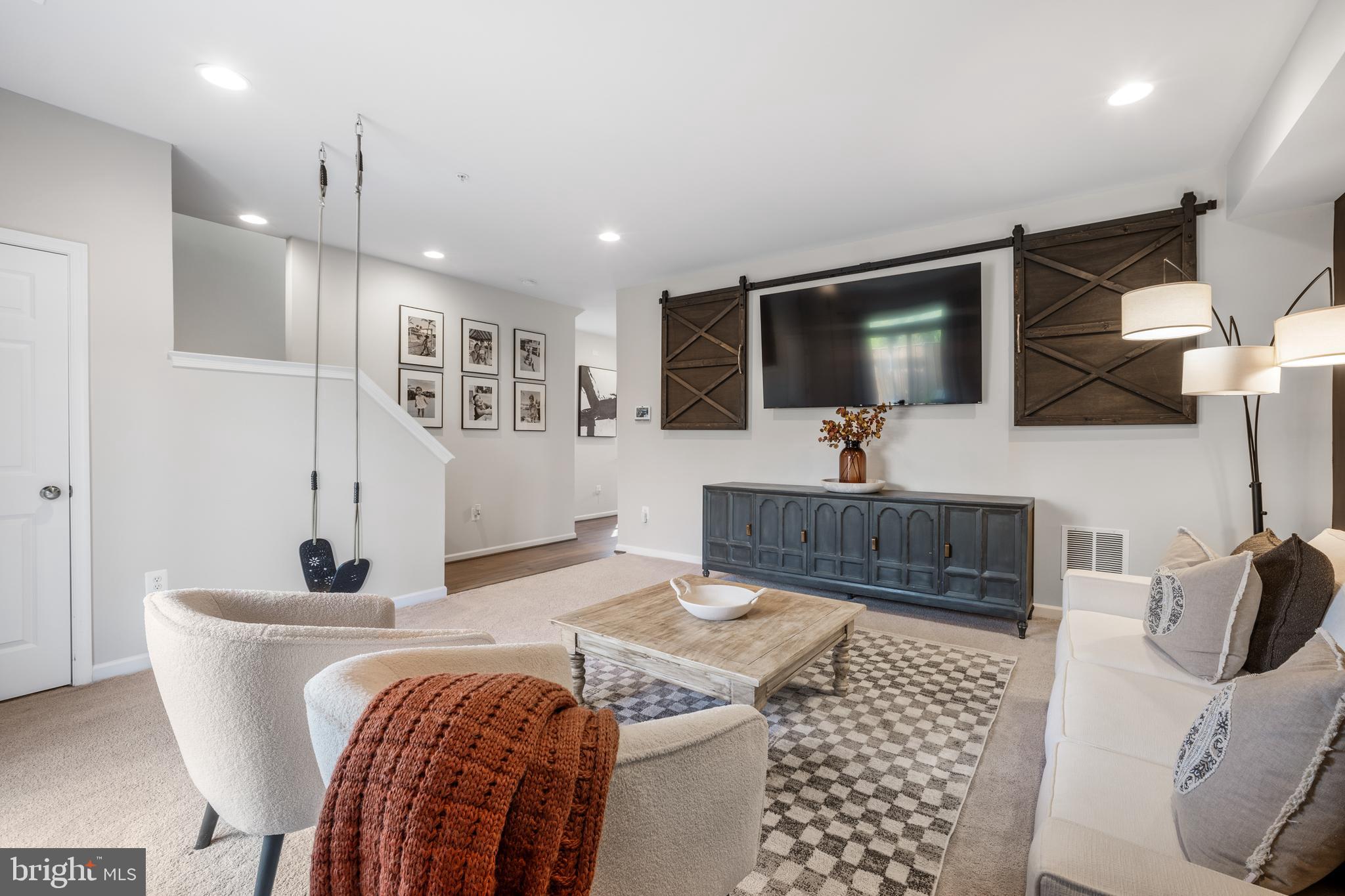 15946 Coolidge Avenue Silver Spring, MD 20906 - Photo 41 of 49 a living room with furniture and a flat screen tv