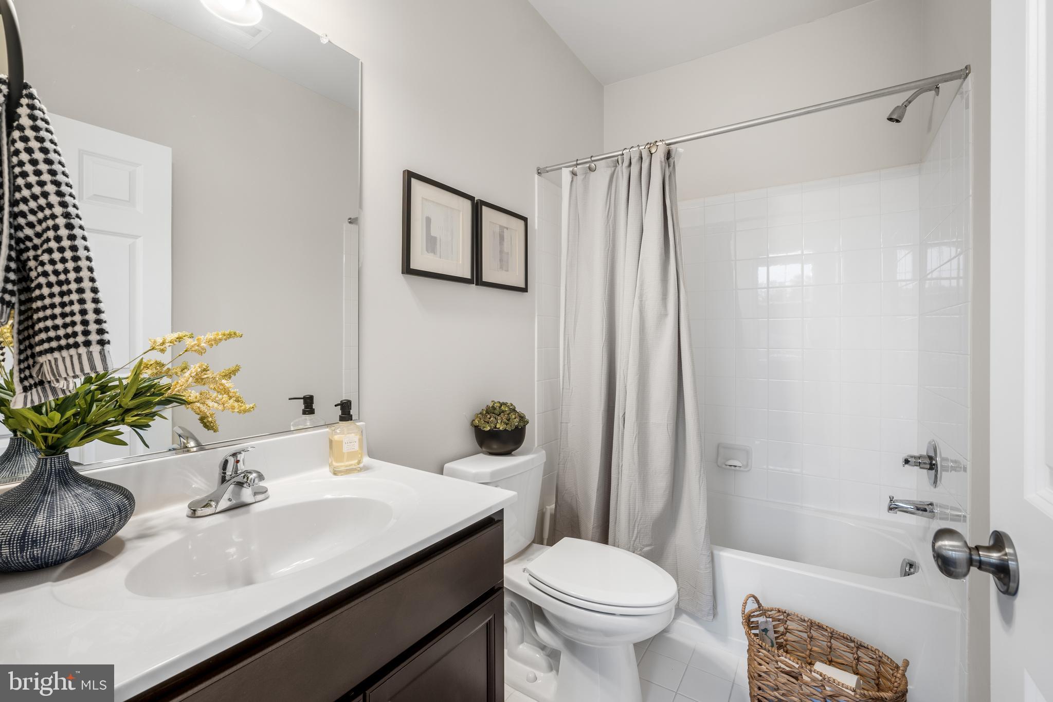 15946 Coolidge Avenue Silver Spring, MD 20906 - Photo 42 of 49 a bathroom with a sink toilet and shower