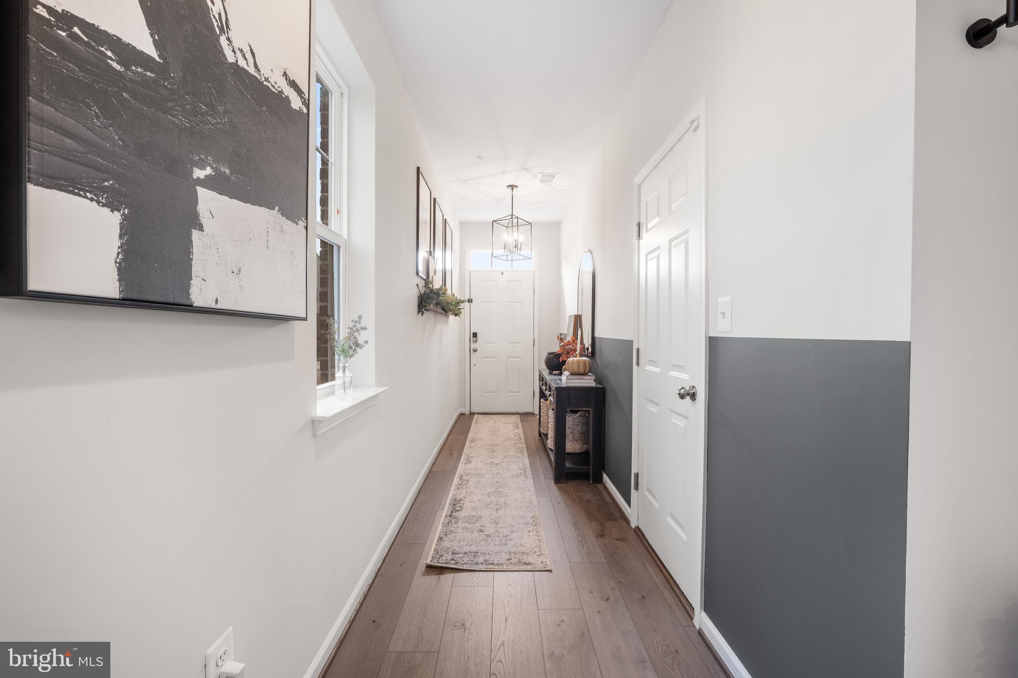 15946 Coolidge Avenue Silver Spring, MD 20906 - Photo 45 of 49 a view of a hallway with wooden floor and staircase
