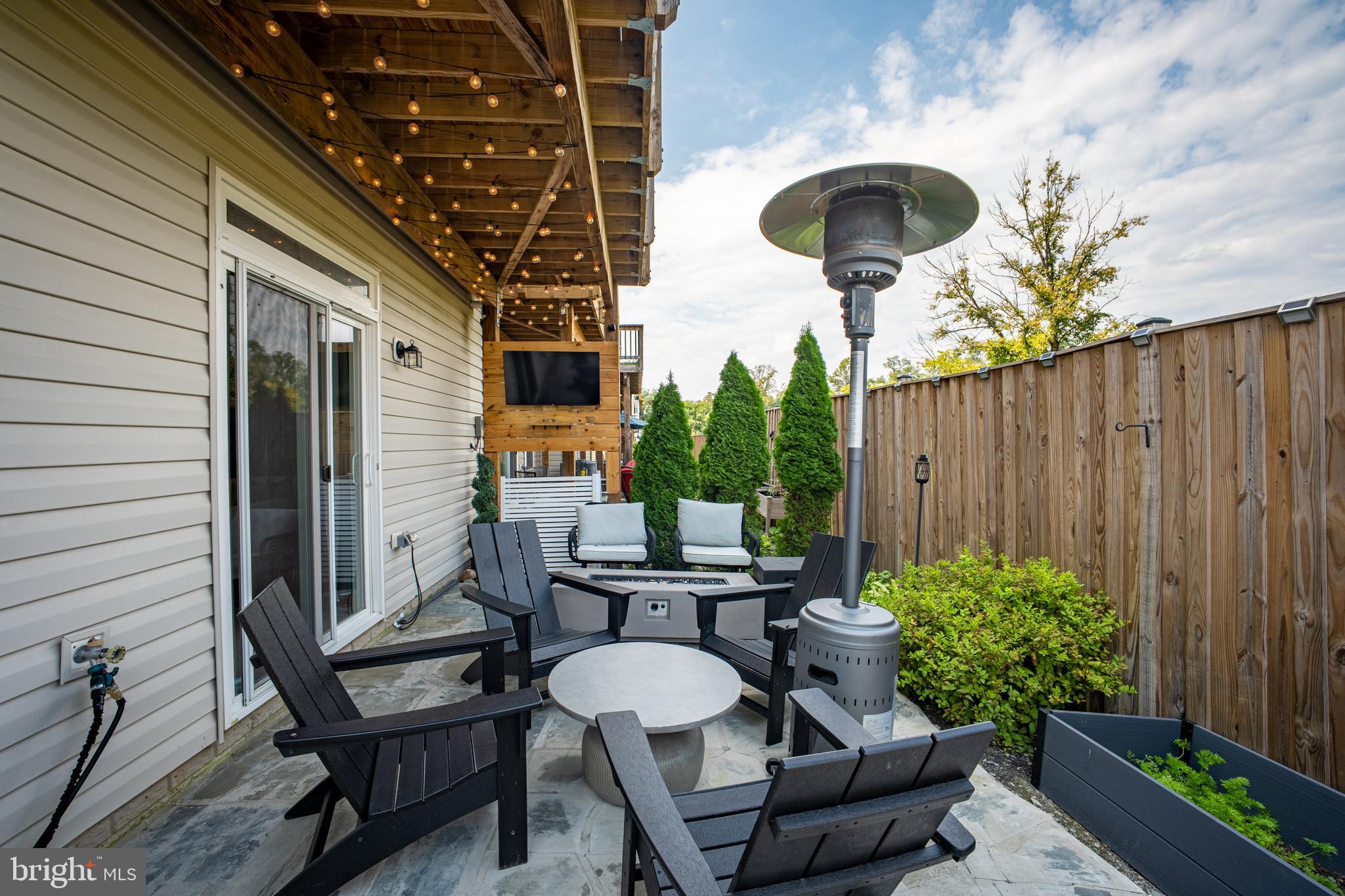 15946 Coolidge Avenue Silver Spring, MD 20906 - Photo 8 of 49 a backyard of a house with table and chairs