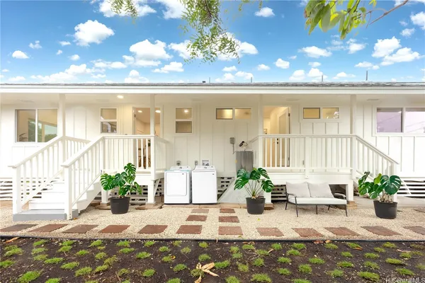 a view of a balcony with potted plants