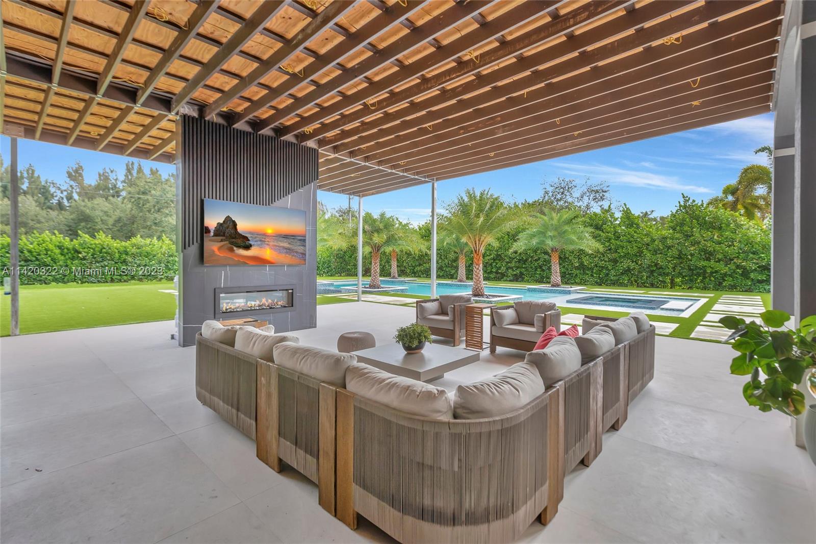 12887 Equestrian Trail Davie, FL 33330 - Photo 34 of 92 a outdoor living space with furniture and garden view