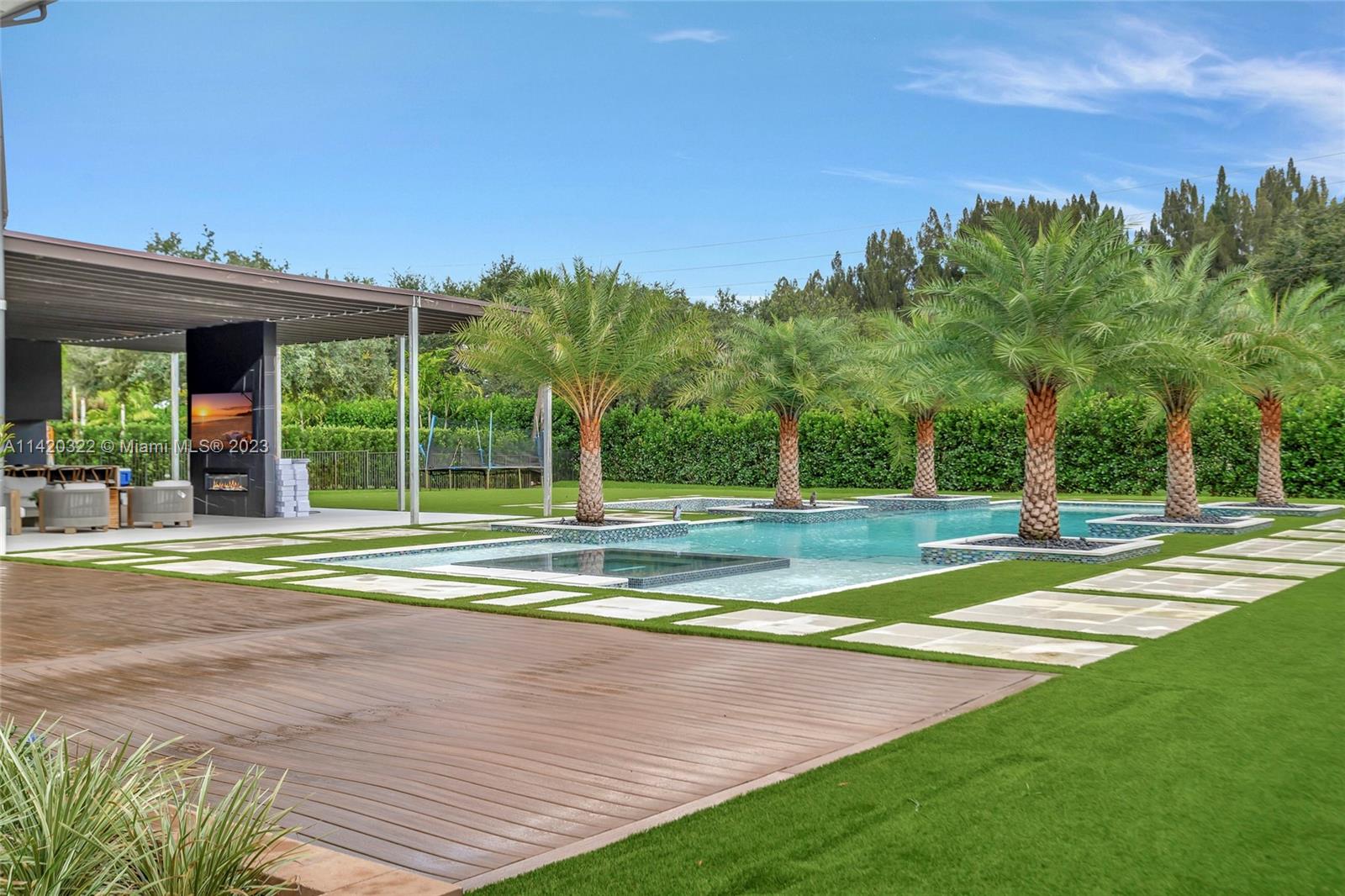 12887 Equestrian Trail Davie, FL 33330 - Photo 43 of 92 a view of a house with a big yard