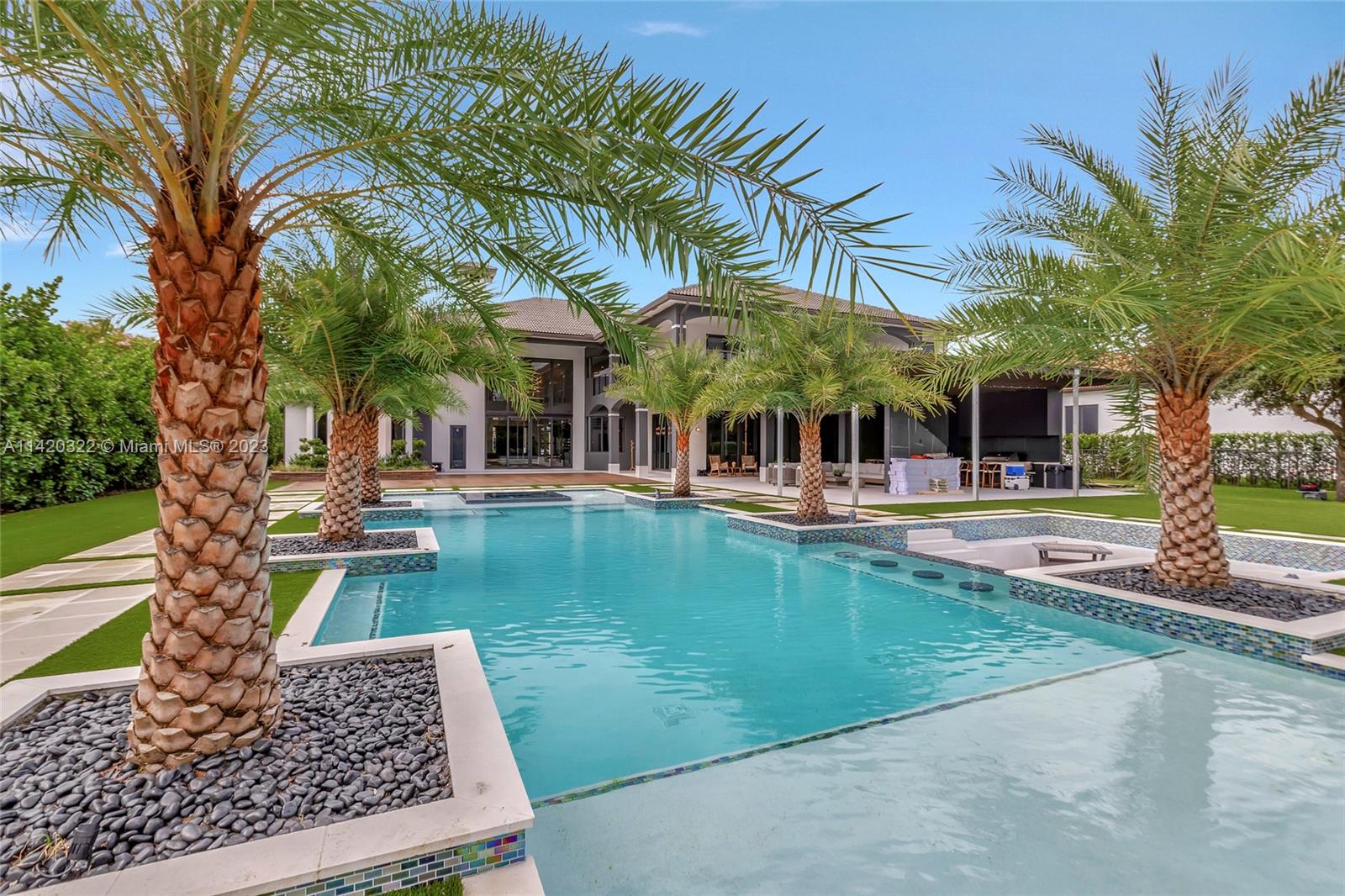 12887 Equestrian Trail Davie, FL 33330 - Photo 44 of 92 a view of a swimming pool with a patio