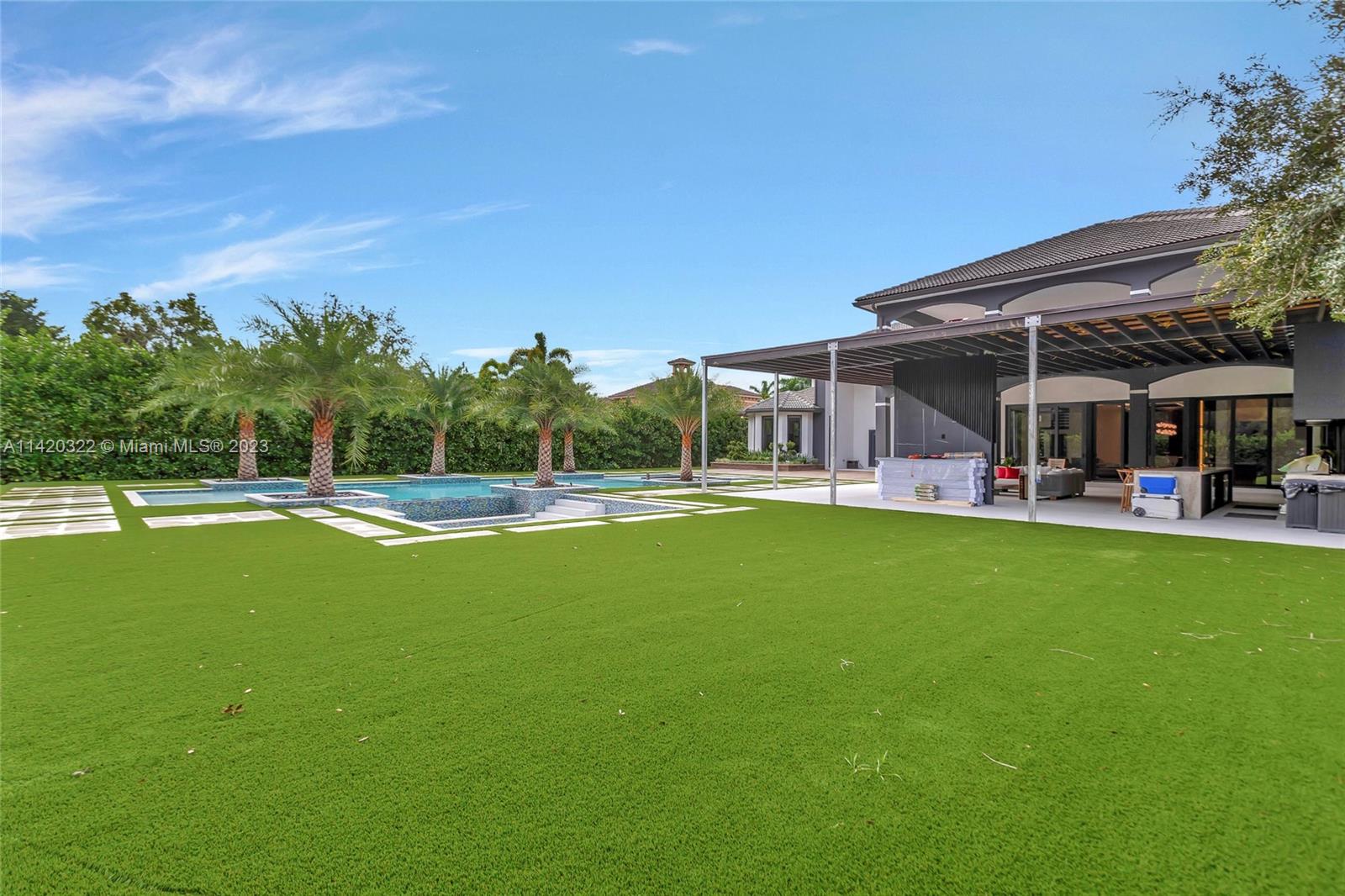 12887 Equestrian Trail Davie, FL 33330 - Photo 46 of 92 a view of outdoor space yard and swimming pool