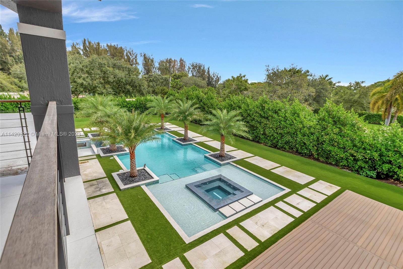 12887 Equestrian Trail Davie, FL 33330 - Photo 66 of 92 a view of a yard from a balcony