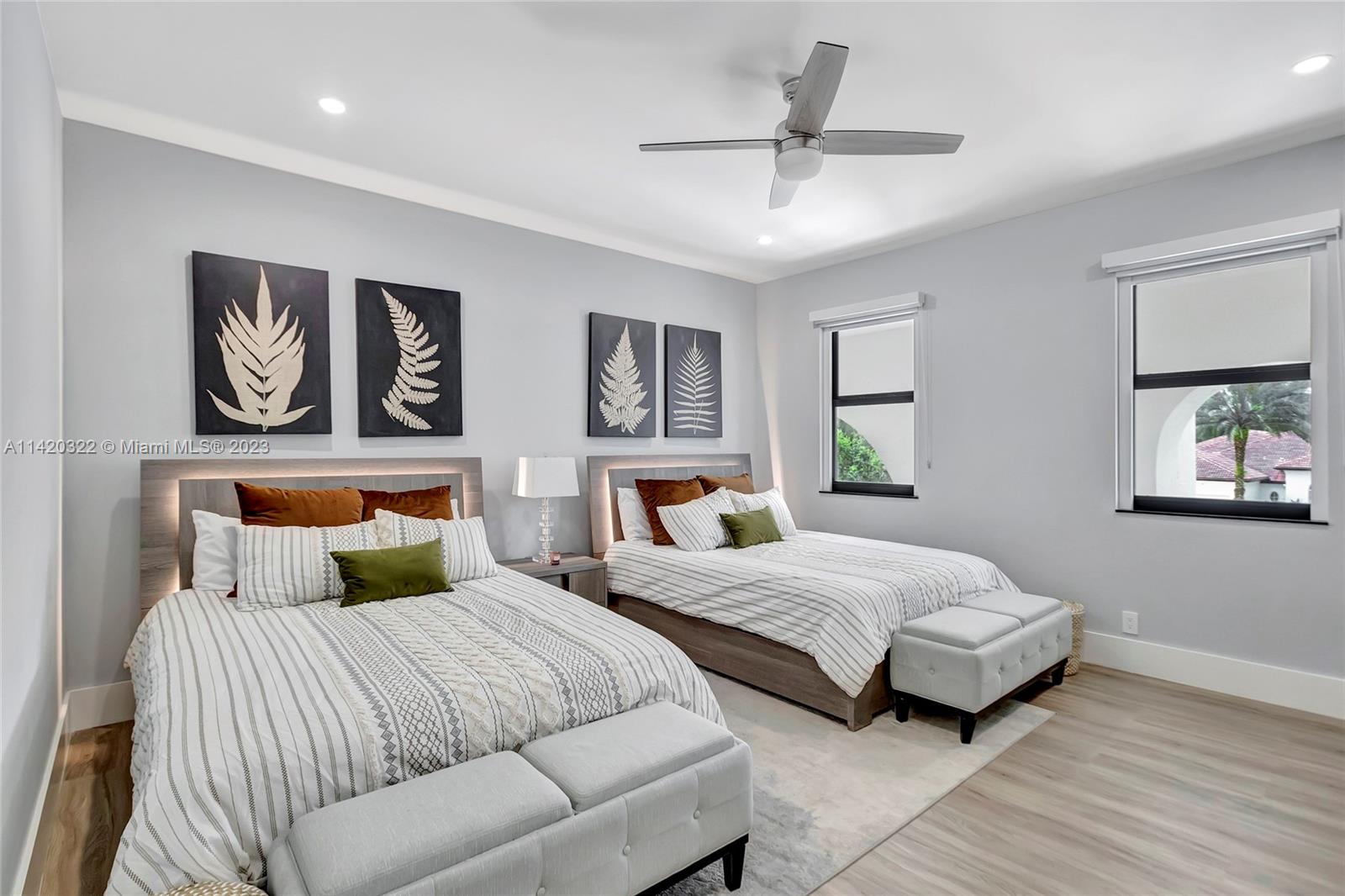 12887 Equestrian Trail Davie, FL 33330 - Photo 72 of 92 a bedroom with two beds and painting on the wall