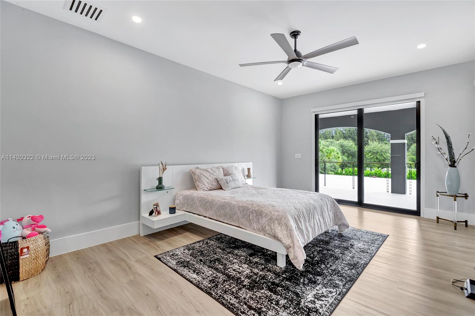 12887 Equestrian Trail Davie, FL 33330 - Photo 75 of 92 a bedroom with a bed and a window