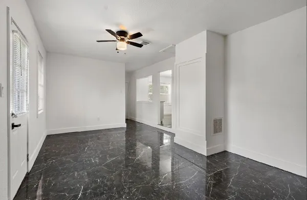 a view of an empty room with a window