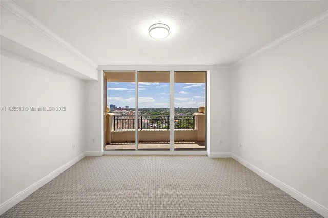a bathroom with a shower and a glass door