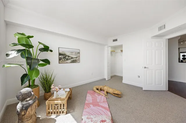 a bathroom with a sink a toilet a mirror and shower