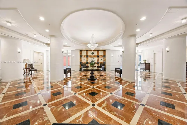 a view of a swimming pool with a lawn chairs and plants