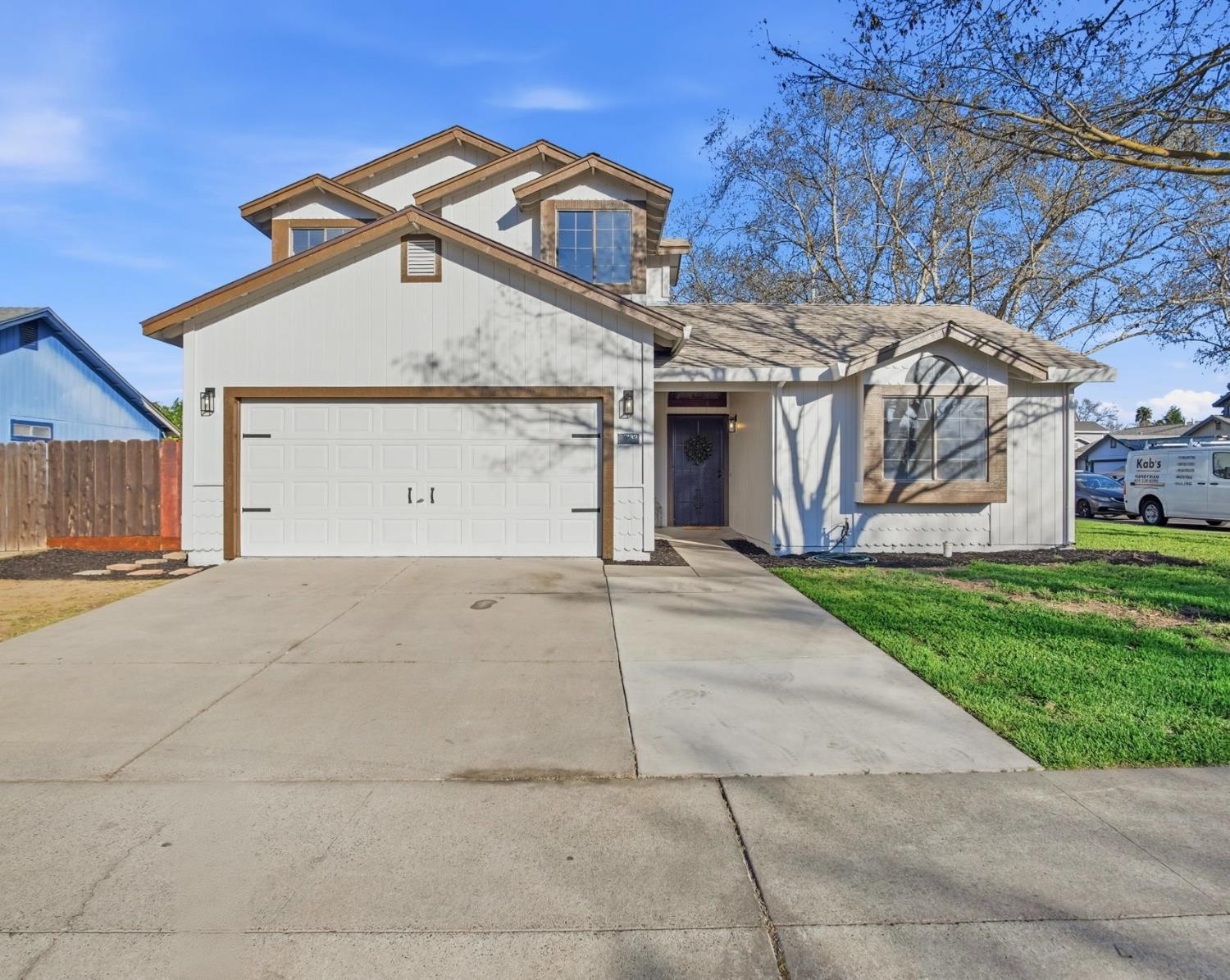 1732 Walpole Drive Modesto, CA 95358 - Photo 1 of 21 a view of a white house with a large space and large trees