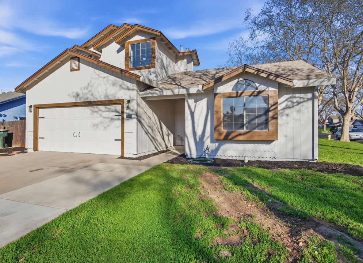 1732 Walpole Drive Modesto, CA 95358 - Photo 20 of 21 a view of a house with a yard and garage