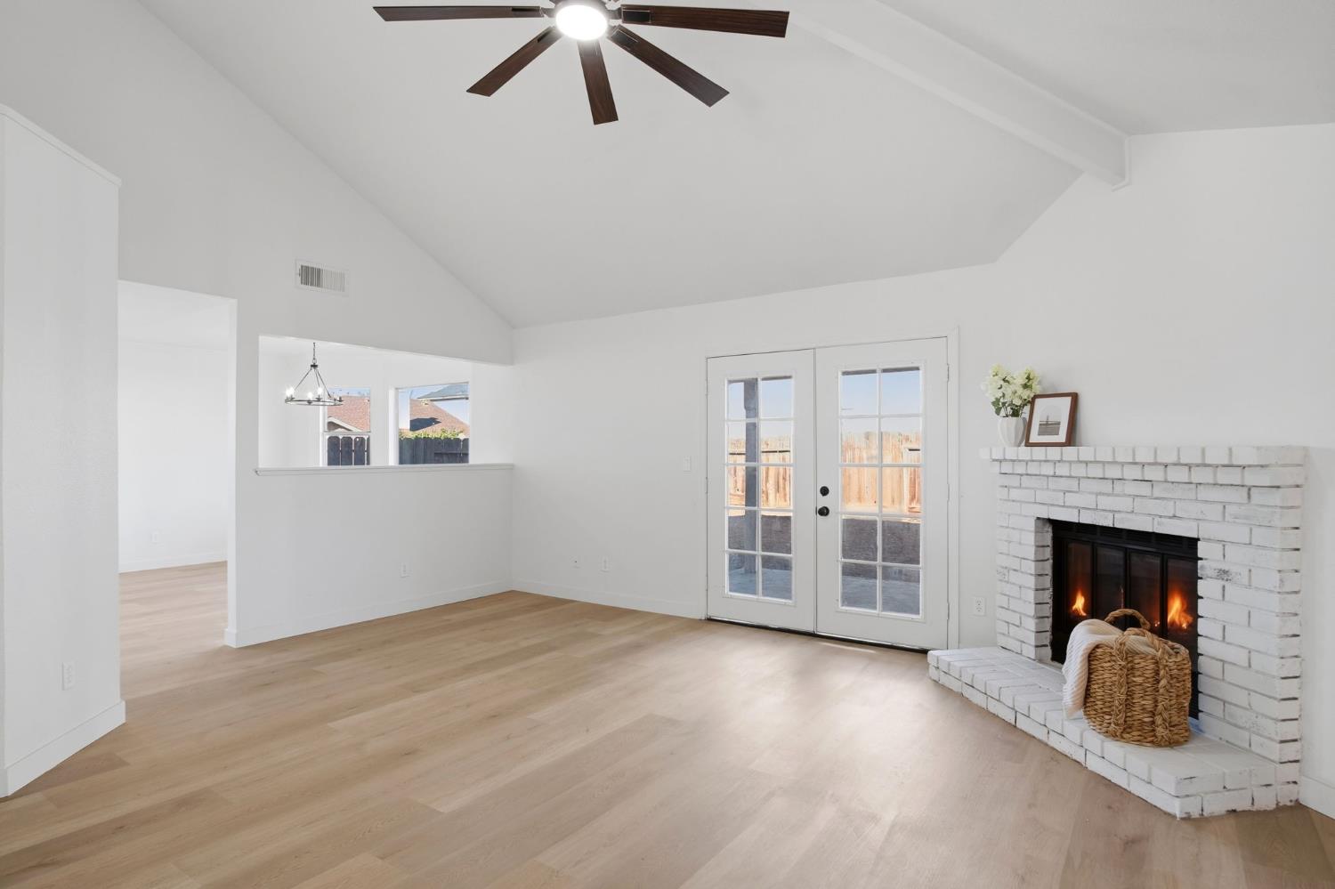 1732 Walpole Drive Modesto, CA 95358 - Photo 3 of 21 an empty room with windows and fireplace