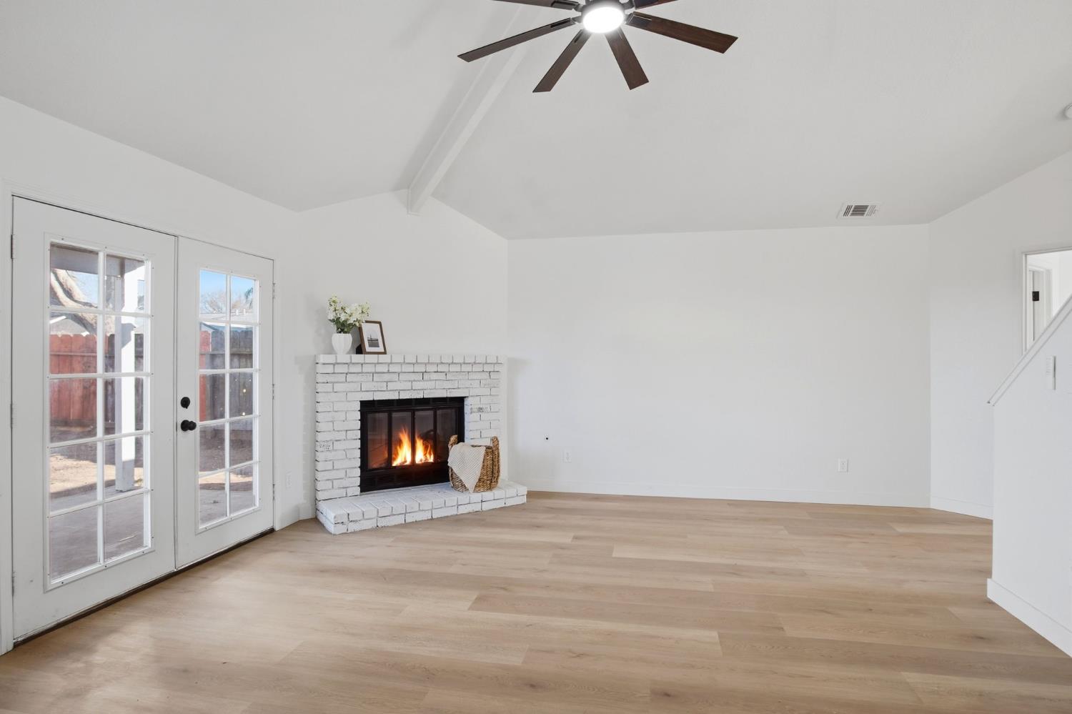 1732 Walpole Drive Modesto, CA 95358 - Photo 4 of 21 a view of an empty room with window and fire place