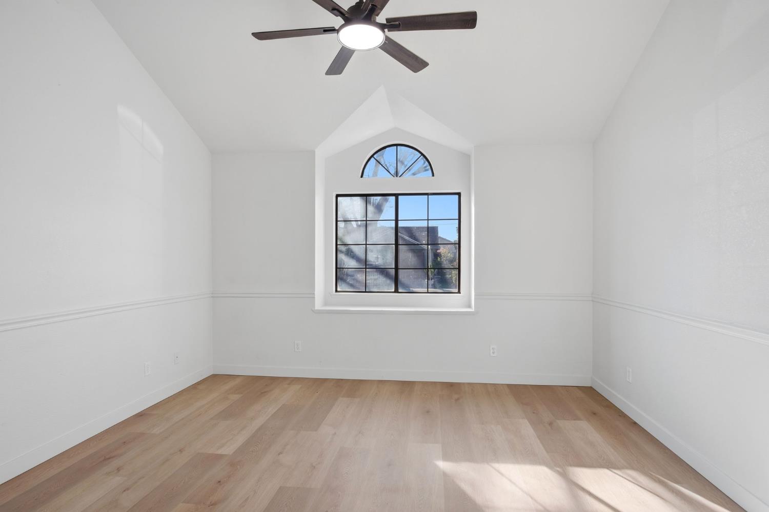 1732 Walpole Drive Modesto, CA 95358 - Photo 10 of 21 an empty room with ceiling fan and window