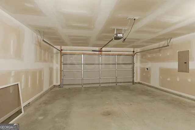 a view of a house with backyard and a tree