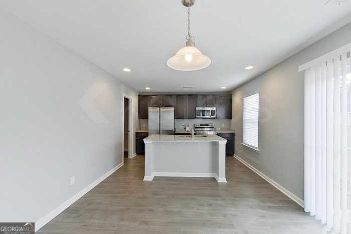 108 Ebenezer Blf Way Springfield, GA 31329 - Photo 4 of 28 a view of a kitchen with a sink and microwave