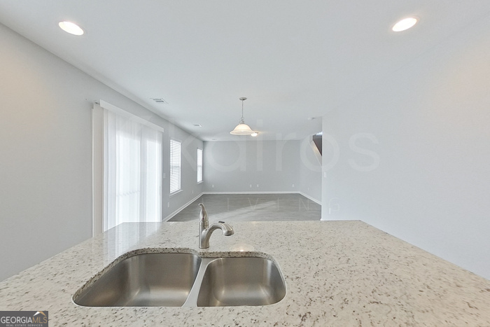 108 Ebenezer Blf Way Springfield, GA 31329 - Photo 6 of 28 a kitchen with a sink and cabinets