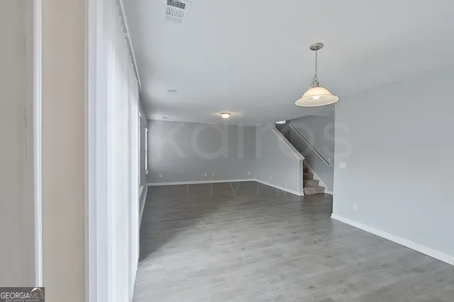 a view of a room with a staircase