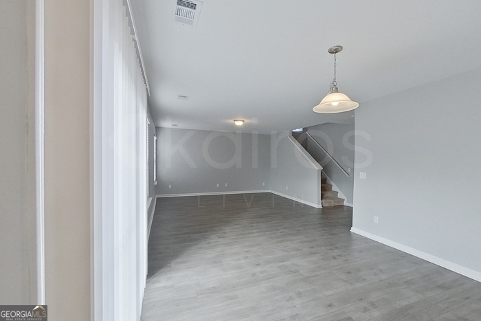 108 Ebenezer Blf Way Springfield, GA 31329 - Photo 10 of 28 a view of a room with a staircase