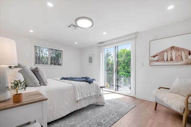 a bedroom with a large bed and a couch