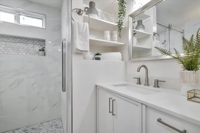 a bathroom with a sink and a mirror