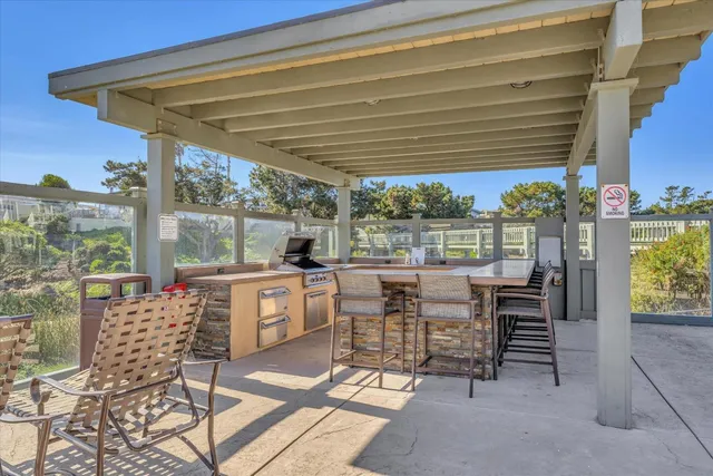 a view of a swimming pool with outdoor seating and a terrace view