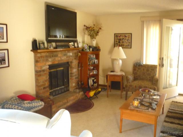 4623 Chestnut Ridge Road, Unit B Amherst, NY 14228 - Photo 3 of 16 Living Room. Living room with woodburning fireplac