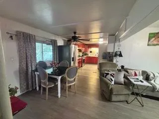 a dining room with furniture and a chandelier