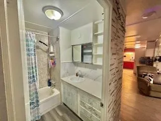 a bathroom with a sink double vanity and shower