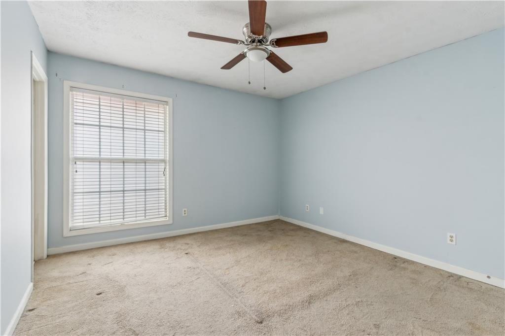 3155 Seven Pines, Unit 303 Atlanta, GA 30339 - Photo 12 of 25 an empty room with chandelier fan
