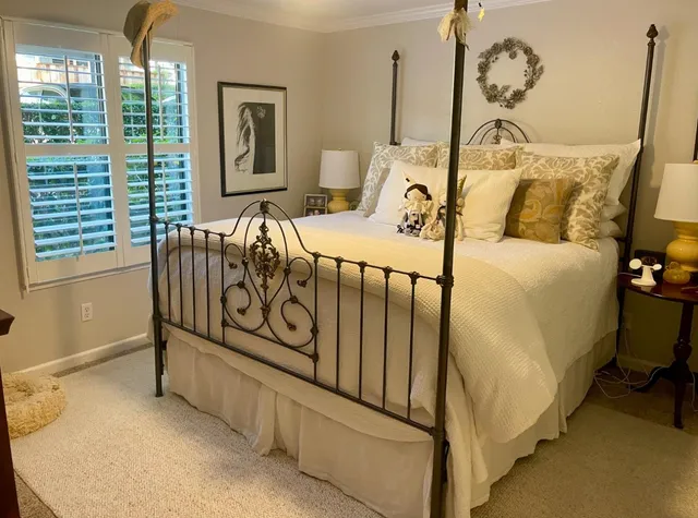 a bedroom with furniture and window